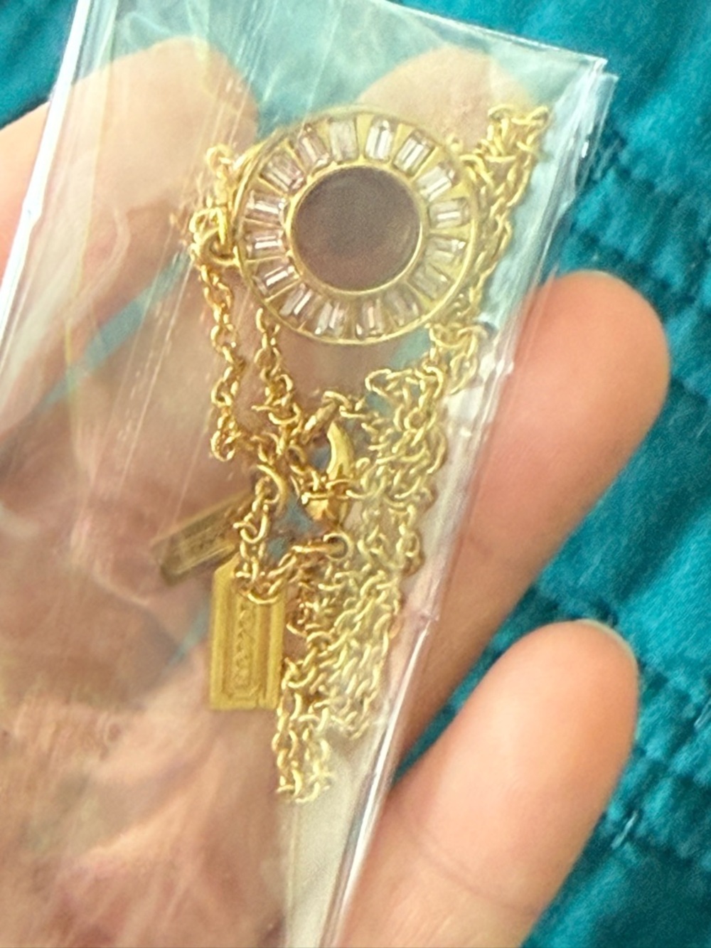 Coach Gold-tone Crystal Circle Pendant Necklace